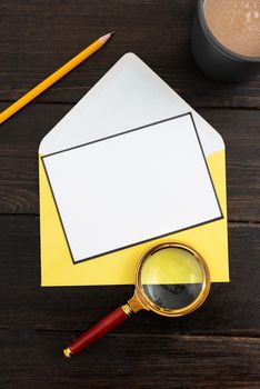 Letter With Stationery And Coffee Over Wood Showing Crucial News.