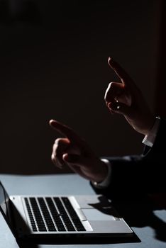 Man And Woman Pointing With Fingers On Important Messages Sitting On Desk.