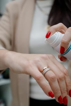 Close up of hands of woman preparing to apply gentle foam facial cleanser.Skin foam