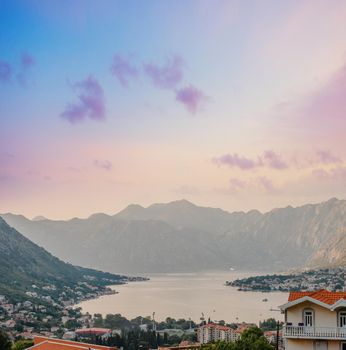 Sunset, beautiful landscape with silhouettes of trees. Travel concept. Montenegro, Kotor Bay. Sunset at Kotor Bay Montenegro. View of the sunset in Boko-Kotor Bay in Montenegro.