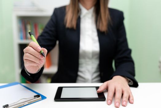 Businesswoman Having Tablet On Desk And Pointing New Ideas With Pen.