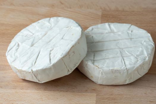 Two Camembert cheese. Preparation for grilling