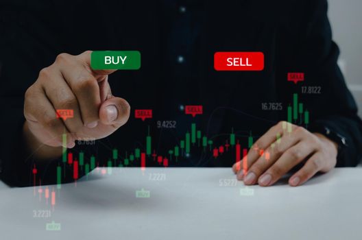 Finance graph with a businessman hand touching a button Stock market exchange future analysis investment forex virtual screen Business digital interface technology concept.
