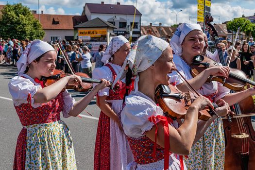 Straznice, Czech Republic - June 25, 2022 International Folklore Festival. beautiful women play in the parade at the festival in Straznice