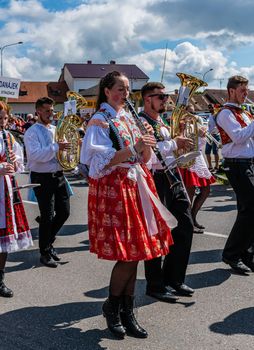 Straznice, Czech Republic - June 25, 2022 International Folklore Festival. brass music in folk costumes marches in a procession