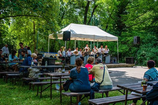 Straznice, Czech Republic - June 23, 2022 International Folklore Festival Audience listens to brass music at the festival