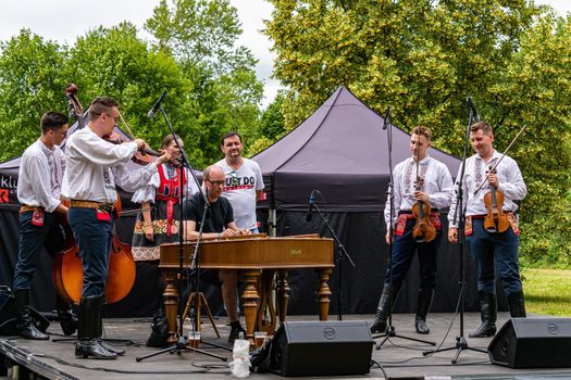 Straznice, Czech Republic - June 23, 2022 International Folklore Festival Dulcimer music plays folk songs at the festival