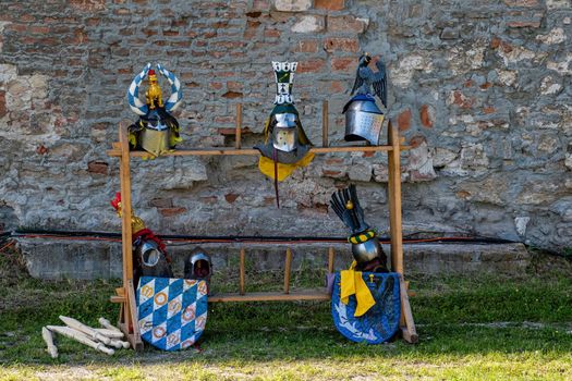 Holic, Slovakia - June 18, 2022 exhibited replicas of historical knightly helmets and shield
