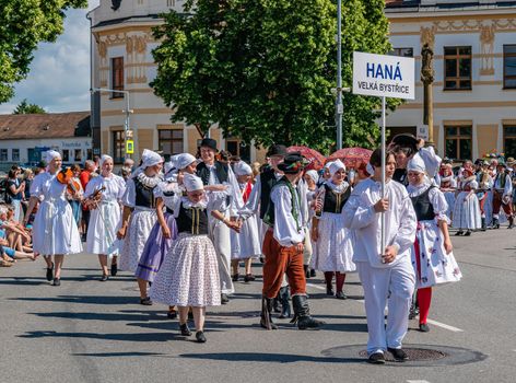 Straznice, Czech Republic - June 25, 2022 International Folklore Festival. Boys and girls bear the name of their ensemble in the procession