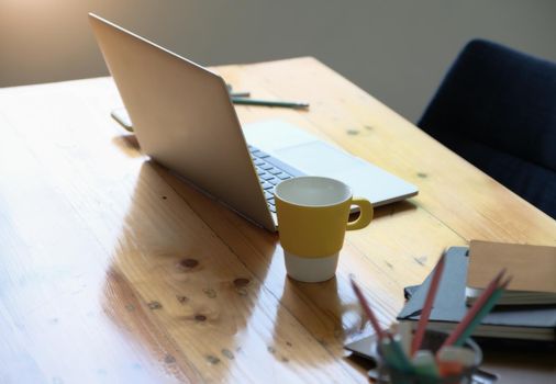 Working concept, computer, coffee mug, books and documents on the desk