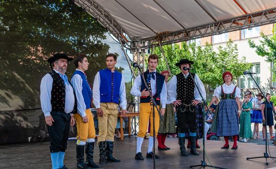 Straznice, Czech Republic - June 25, 2022 International Folklore Festival. Folk ensemble in folk costumes on stage