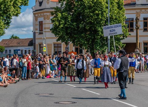 Straznice, Czech Republic - June 25, 2022 International Folklore Festival. Bagpipe music at the festival in the procession