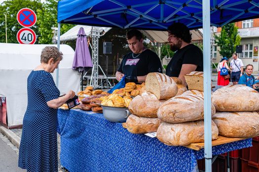 Straznice, Czech Republic - June 23, 2022 International Folklore Festival Sales stand with home baked bread