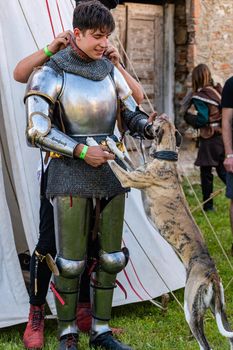 Wyvar castle festThe knight greets his dog. Show of affection
