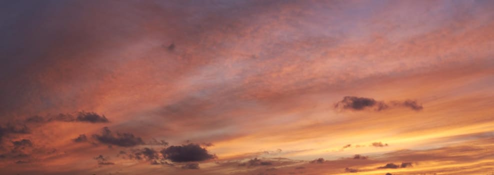 Copy space of clouds in a moody sky at twilight. Scenic panoramic and banner of a dramatic cloudscape and thunderous background at sunrise or sunset. Climate of gloomy dark weather at dawn outdoors.