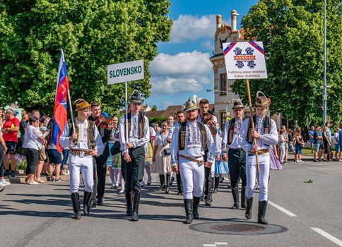 Straznice, Czech Republic - June 25, 2022 International Folklore Festival. Slovaks carry the symbols of their country at the Straznice festival