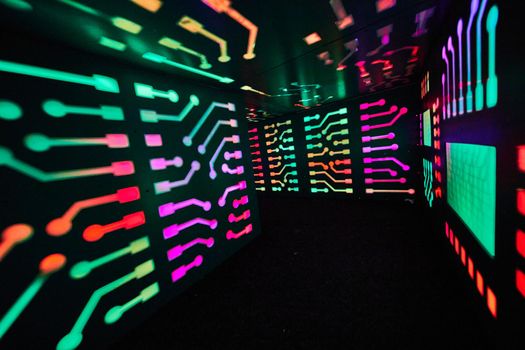 Image of Multi-color computer lights in small tunnel