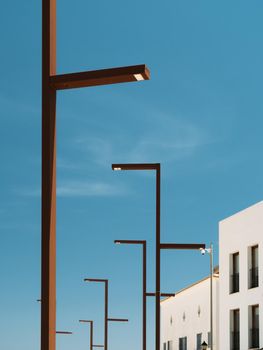 Modern street lampposts at Ibiza. Metal lanterns designed for urban lighting