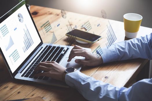 Business woman using computer to trade charts to find buy and sell points for her port