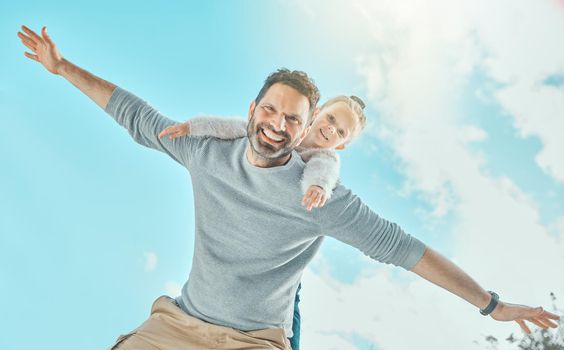 a father spending time outdoors with his young daughter.