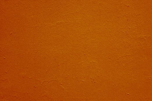 Red-brown colored cement plaster wall texture.