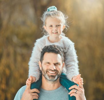 a father spending time outdoors with his young daughter.