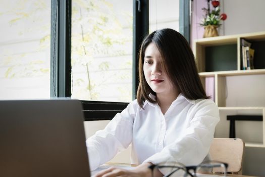 freelance concept,female using computers to design work as ordered by customers at home