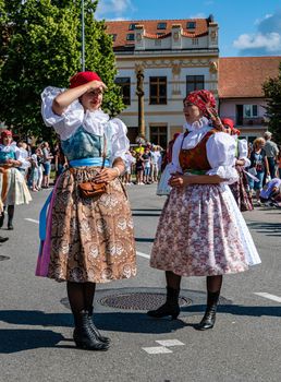 Straznice, Czech Republic - June 25, 2022 International Folklore Festival. Two girls in folk costumes at the Straznice festival