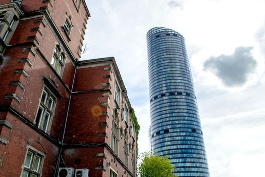 Evening view of Sky Tower office building with light auto trails in Wroclaw, Poland. High quality photo