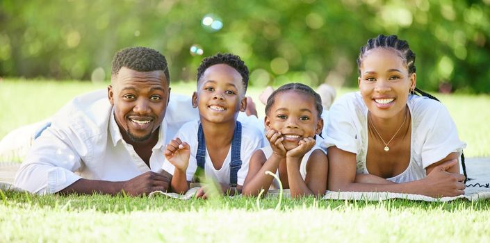 a couple spending time outdoors with their two children.