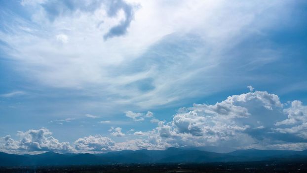 Aerial view of the blue sky with white clouds in summer day. Time lapse of white clouds and sunny blue skies. Natural background in motion. drone shooting clouds motion time