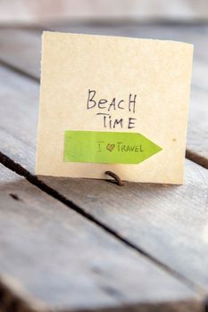 Sign with the inscription beach time. Summer travel idea. High quality photo