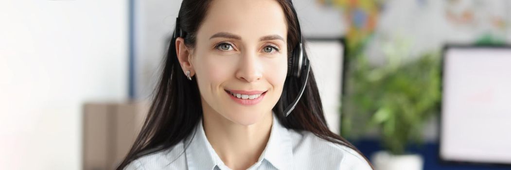 Portrait of lady support service worker wear headset with microphone for voice connection. Operator on line in office. Customer service, consultant concept