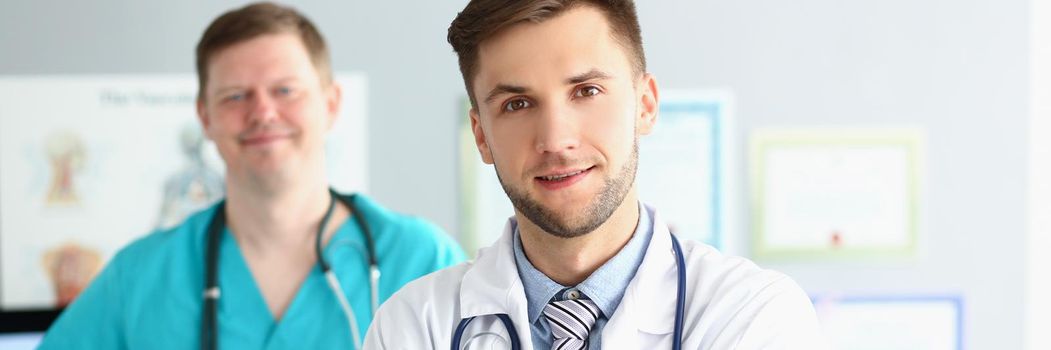 Portrait of medical male workers in uniform with stethoscopes, medical help, emergency team, qualified doctor and nurse. Save life, medicine, help concept