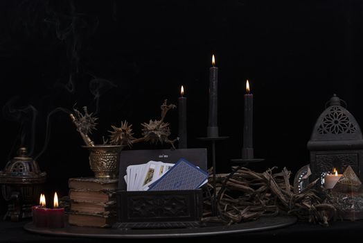 Witch laboratory with potion, elixirs, glass bottles, dry flowers, herbs and ingredients. Esoteric, wicca and occult background, fortune telling and divination ritual, mystic concept