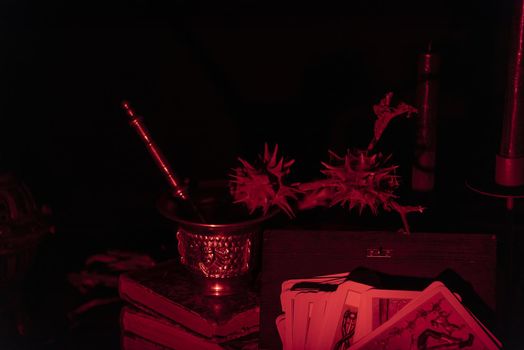 Witch laboratory with potion, elixirs, glass bottles, dry flowers, herbs and ingredients. Esoteric, wicca and occult background, fortune telling and divination ritual, mystic concept