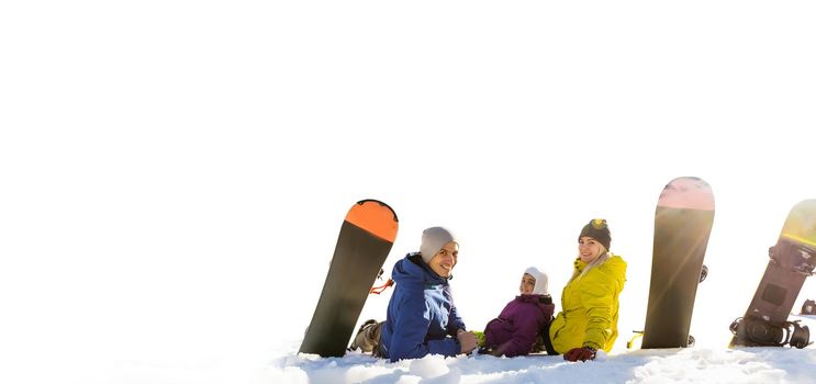 Portrait of happy family with snowboards looking at camera on white background