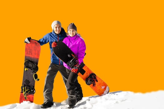 Happy couple of snowboarders having fun with snowboards.