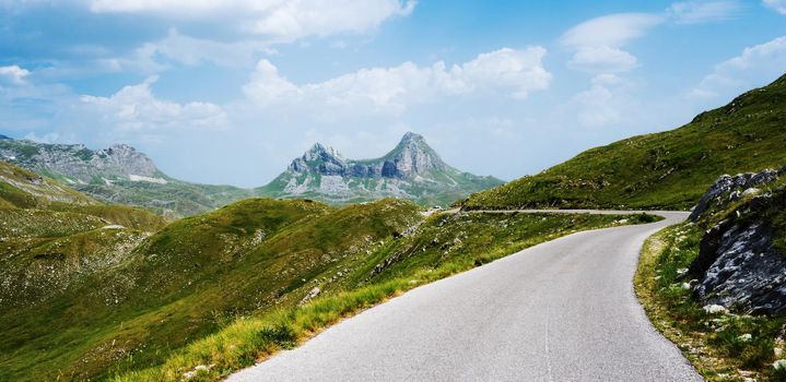 Scenic serpentine road with mountains view in National park Durmitor in Montenegro. Amazing balkan nature in summer day