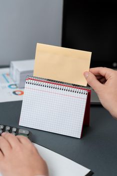 Woman Holding Note With Important News On Desk With Notebook With New Idea