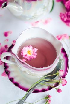 retro porcelain cup of hot rose tea. High quality photo