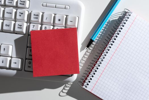 Important Messages Written On Note On Desk With Pen, Notebook And Keyboard.