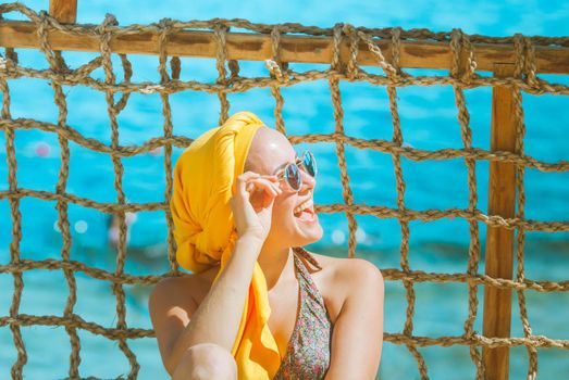 woman is smilling in the beach. High quality photo