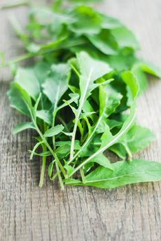 fresh home picked rucola on wooden background