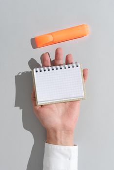 Woman Holding Notepad With Important Message On Office Desk With Marker.