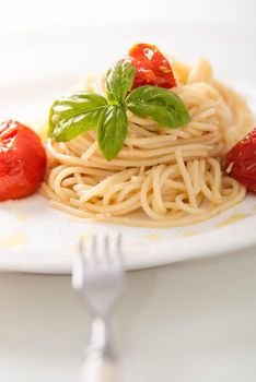 delicious pasta spagetti with backed cherry tomatoes