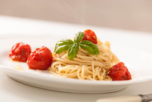 delicious pasta spagetti with backed cherry tomatoes