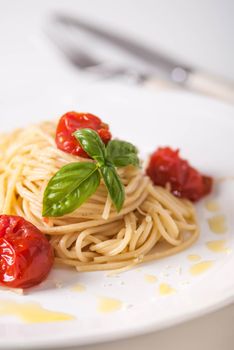 delicious pasta spagetti with backed cherry tomatoes