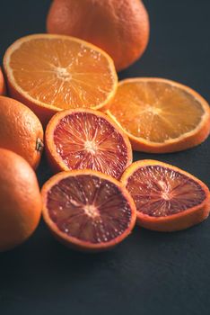 red bloody sicilian oranges on black background