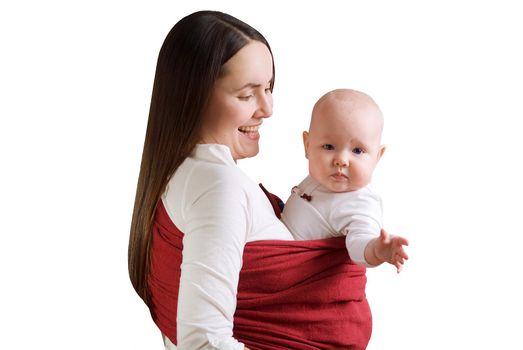 Mother carring beautiful baby in bright red sling